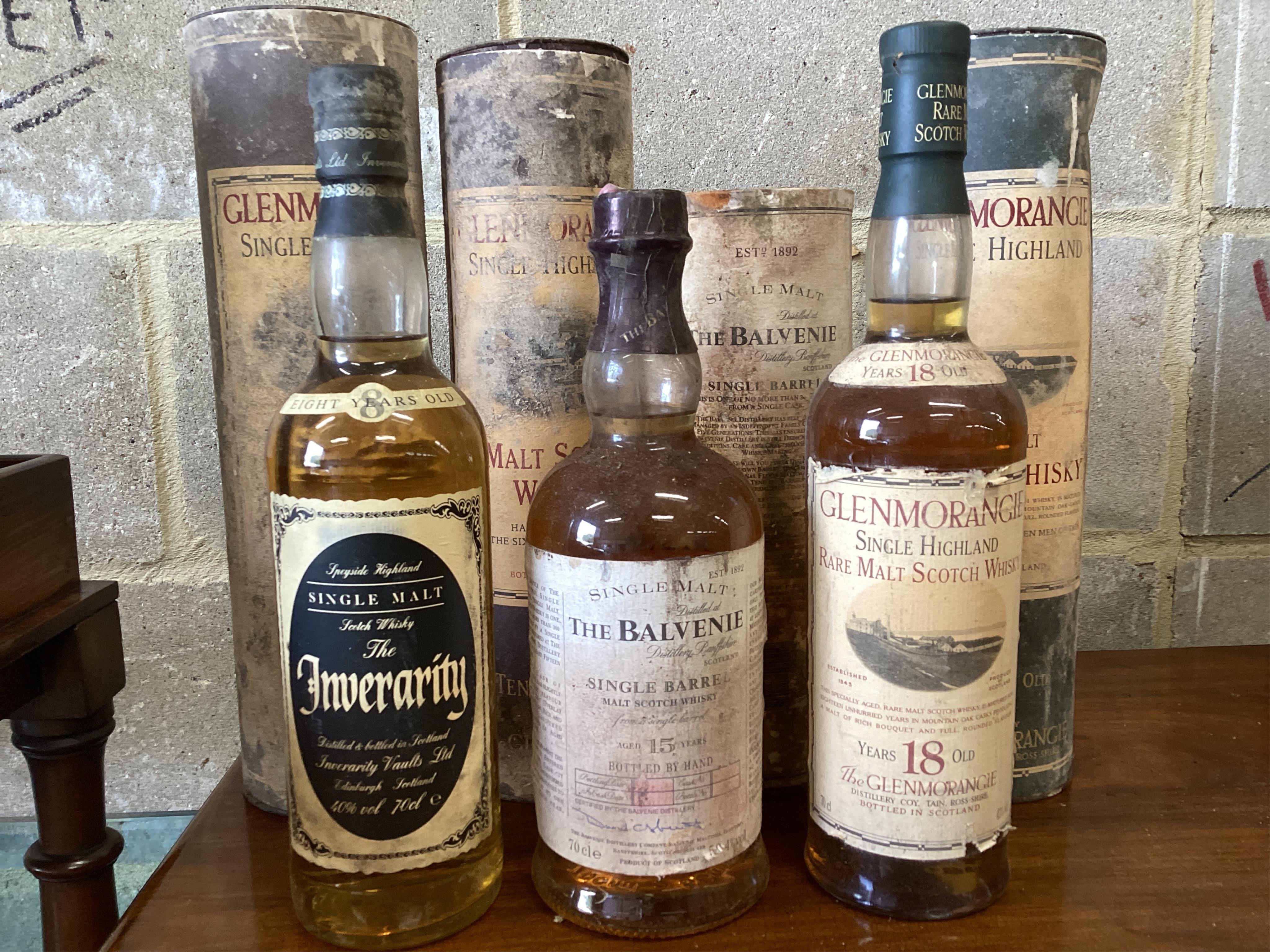 Five bottles of vintage single malt Whisky, The Balvenie, Glenmorangie and Inverarity. (From a local private cellar). Condition - labels degraded